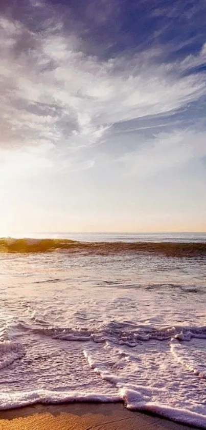 Serene beach waves with sunset sky.