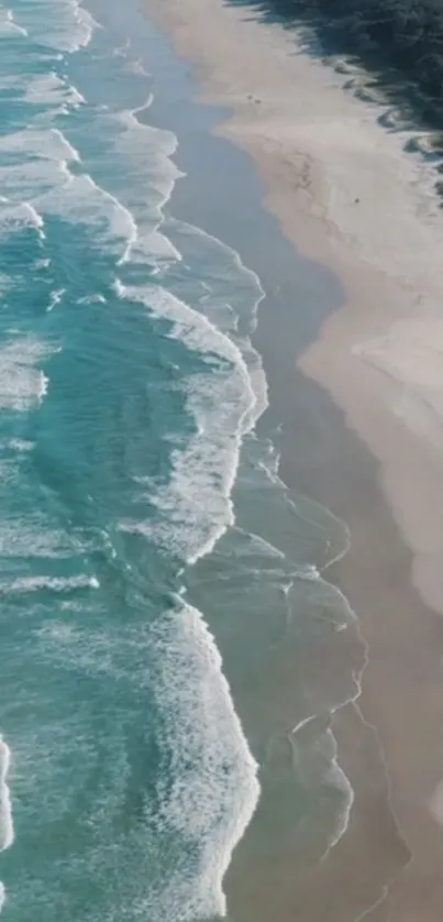 Aerial view of ocean waves meeting sandy beach, perfect for mobile wallpaper.