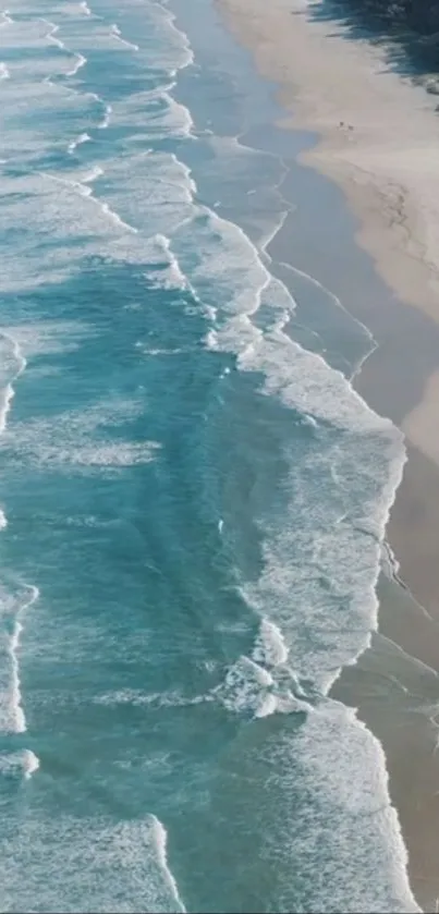 Aerial view of peaceful beach with turquoise ocean waves.