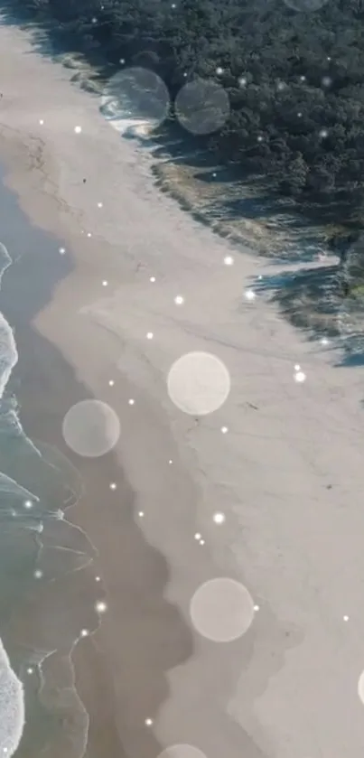 Peaceful beach with waves and sunlight sparkles on the sand.