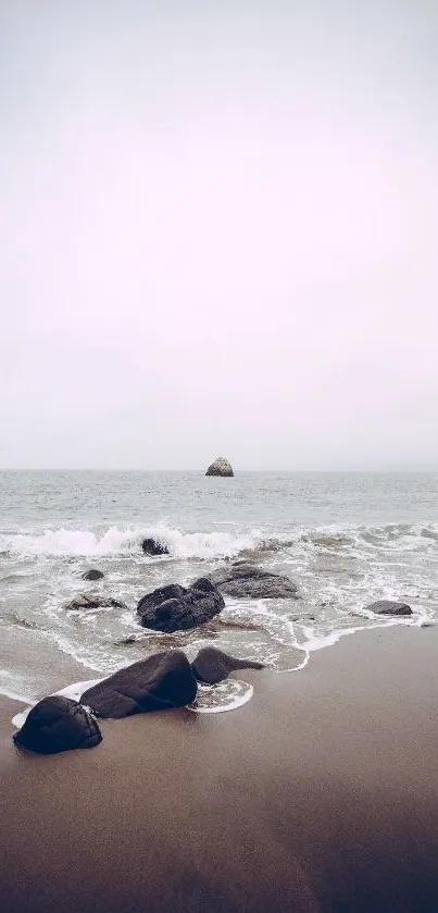 Tranquil beach with gentle waves and a distant ocean horizon.