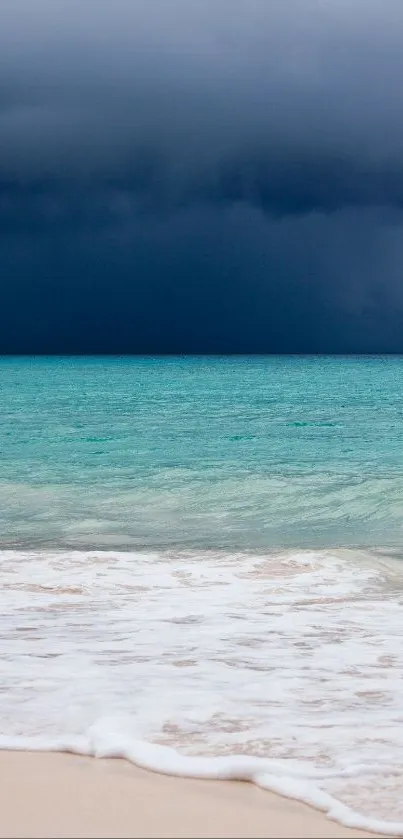 Serene beach with turquoise waters and a stormy dark sky in the background.