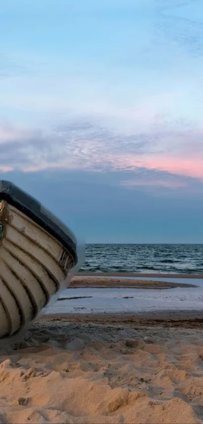 Peaceful beachfront with a boat on sandy shore and pastel sky.