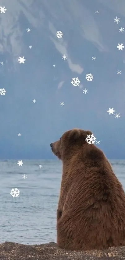 Bear on a shoreline overlooking lake and mountain.