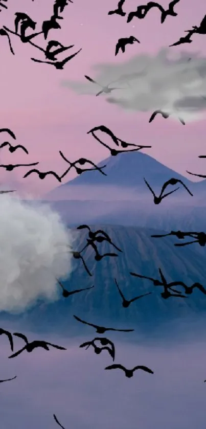 Birds flying over misty mountains at dawn.