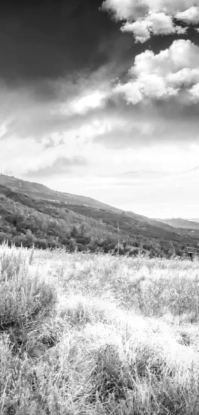 Black and white mountain landscape with a dramatic sky.