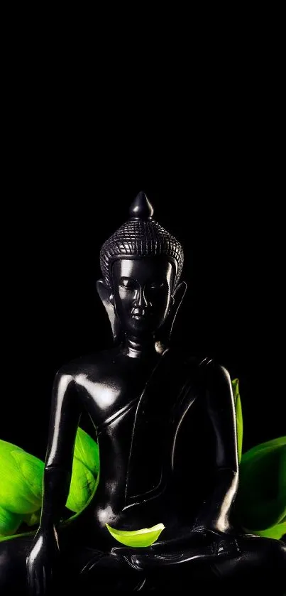 Black Buddha statue with green leaves on a dark background wallpaper.