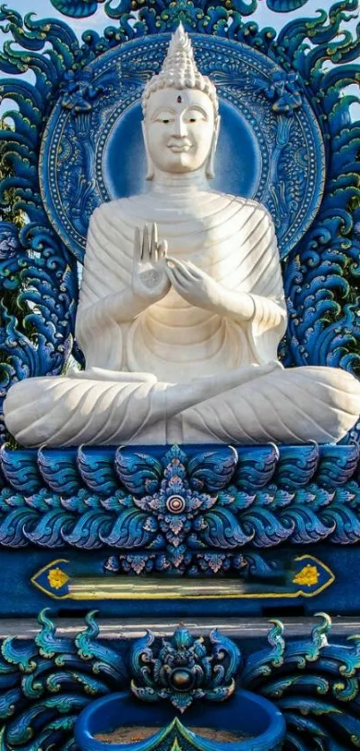 Intricate blue Buddha statue in serene setting.