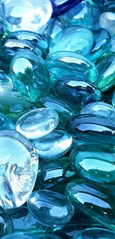 Close-up of smooth, glossy blue glass stones with a tranquil appearance.