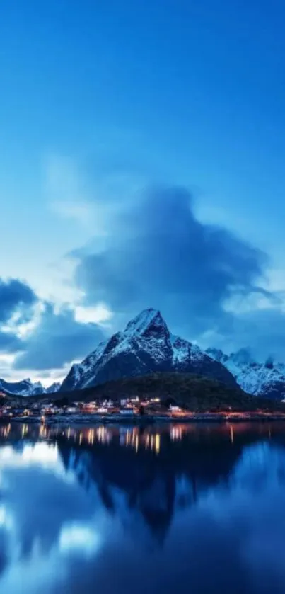 Blue mountain landscape reflecting in tranquil lake.