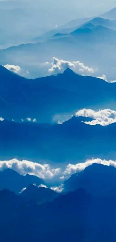 Serene blue mountain landscape with clouds.