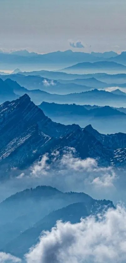 Serene blue mountains with misty clouds in the background.