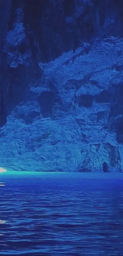 A serene view of a blue ocean cave with calm water and rocky formations.