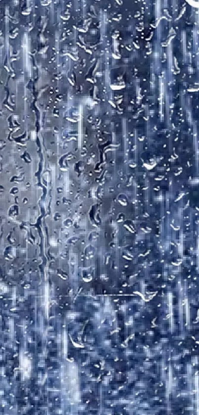 Raindrops cascading on a blue background creating a calming visual effect.