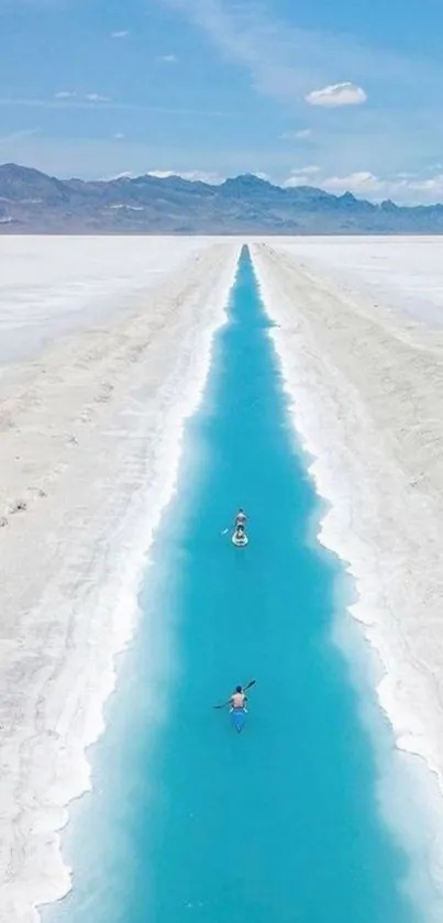 A serene blue river cutting through a vast salt flat under a clear sky.