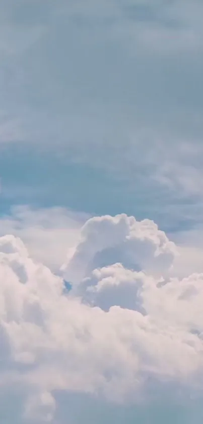 Serene blue sky with fluffy white clouds.