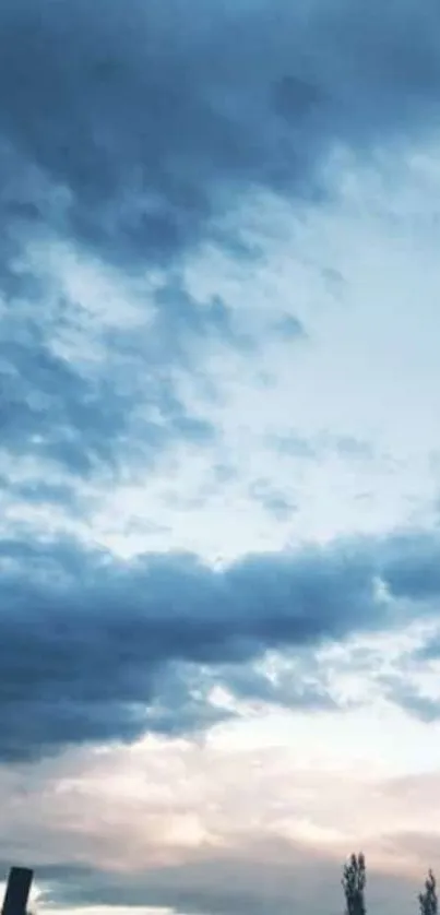 Tranquil blue sky with scattered clouds.