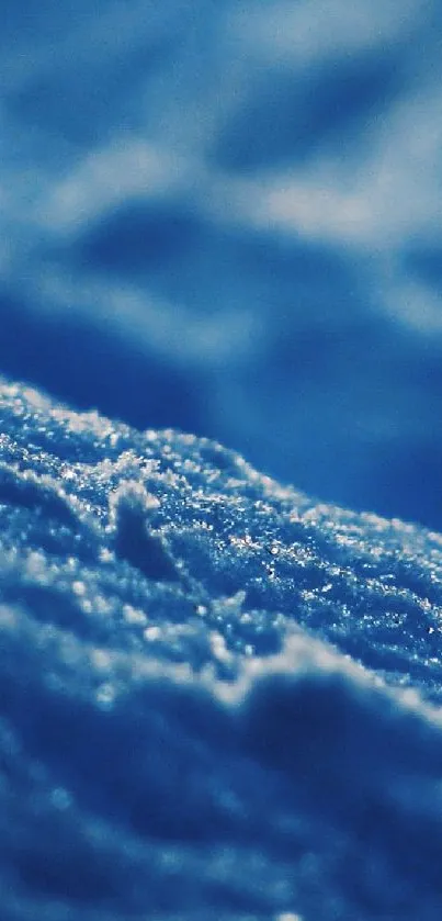 Serene blue textured wallpaper with snow-like details.