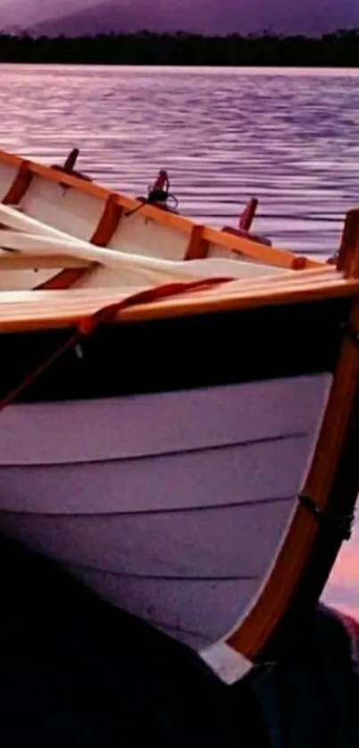 Wooden boat on purple water at sunset, tranquil scene.