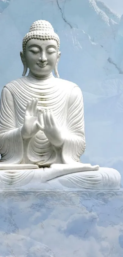 Buddha statue with misty mountains and clouds.