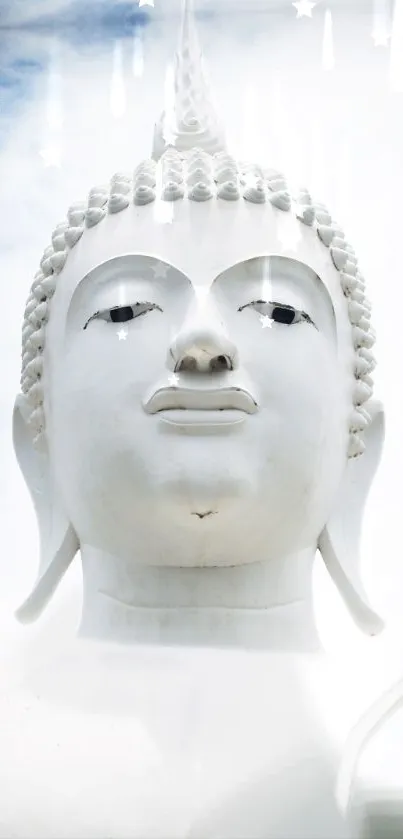 Serene white Buddha statue under a blue sky.