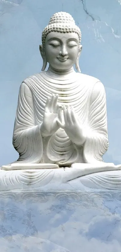 Serene Buddha statue on a soft blue sky background.