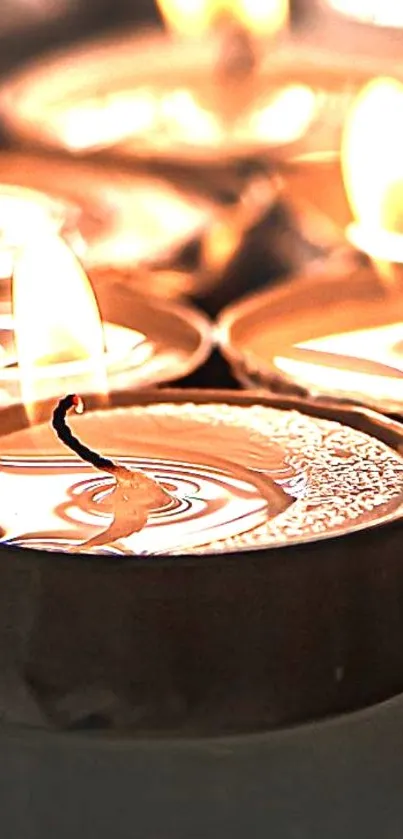 Close-up of glowing candle flames creating a serene ambiance.