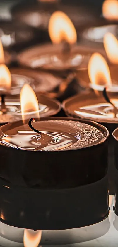 Cozy candlelight wallpaper with glowing flame ambiance.