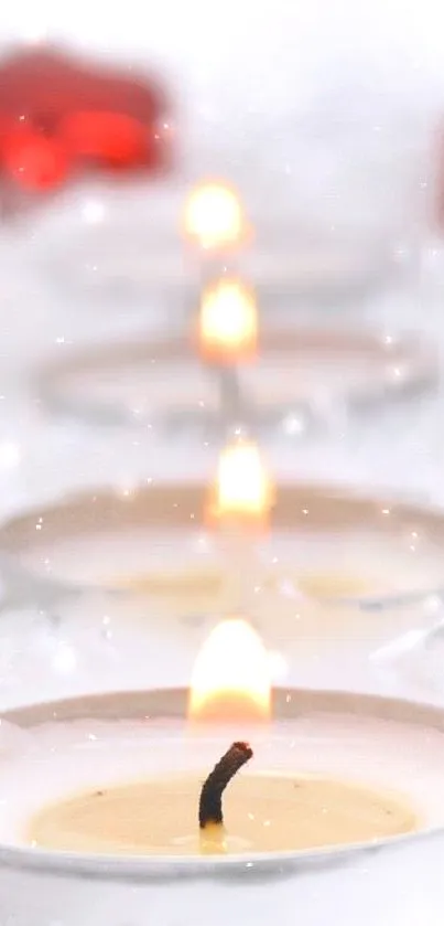 Serene mobile wallpaper with glowing candles and soft bokeh.