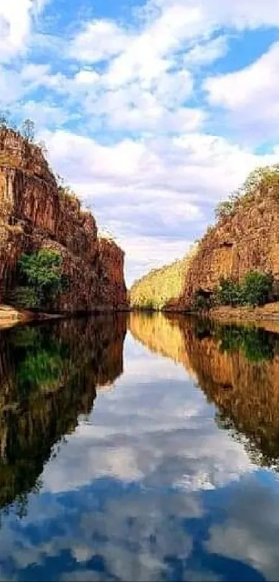 Canyon with reflective water and vibrant cliffs under a clear sky.