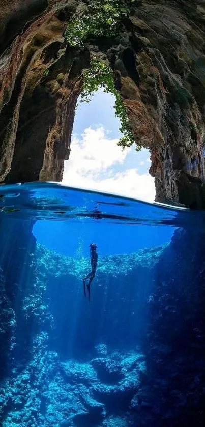 Diver exploring a serene underwater cave with blue waters.