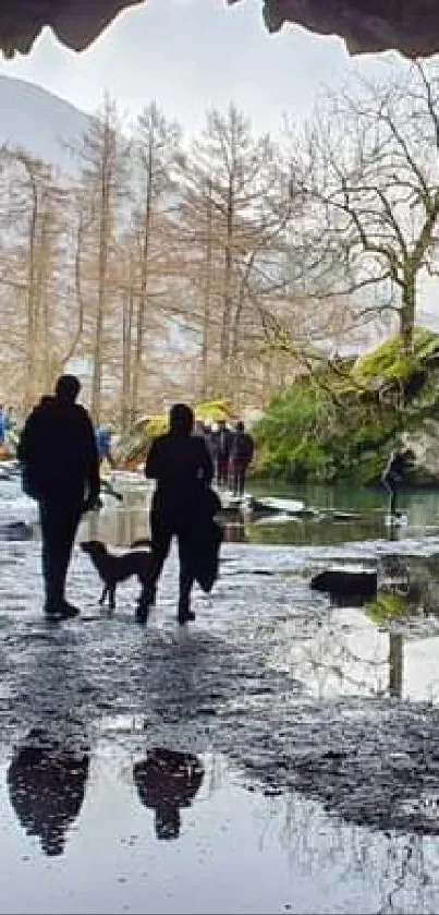 Silhouettes in a cave with reflection on water, stunning natural scenery