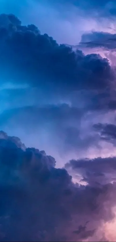 Mobile wallpaper featuring purple and blue clouds in a mystical sky.