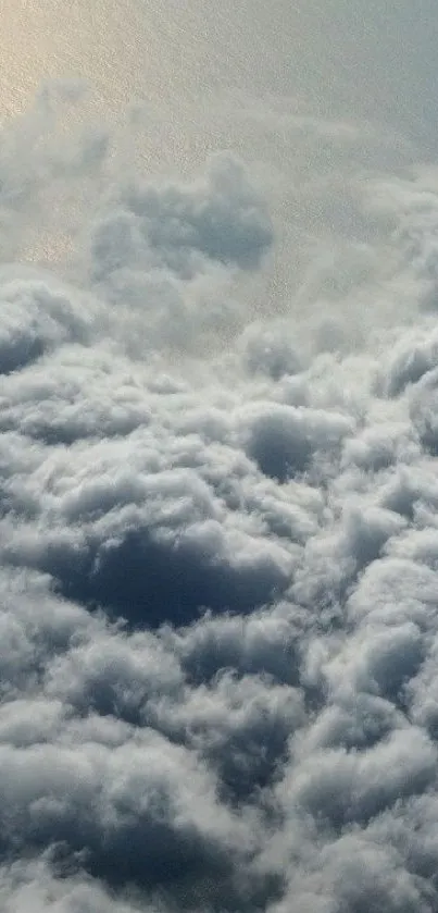 Serene cloudscape with soft clouds and blue sky.