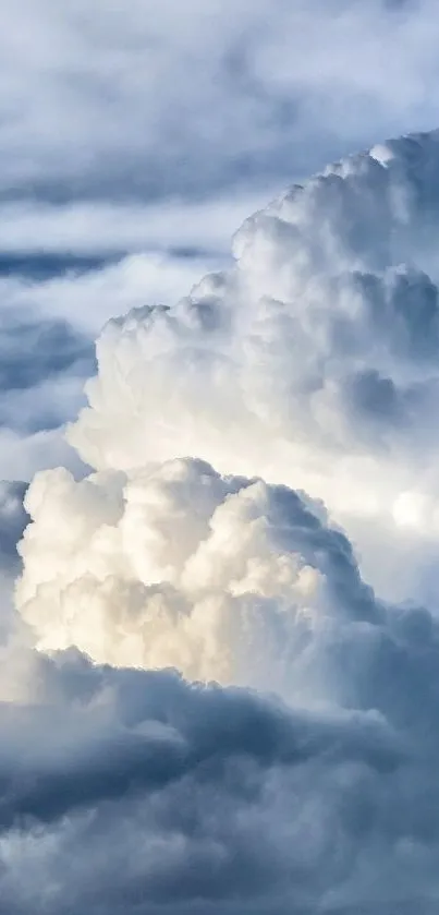 Fluffy white clouds against a serene blue sky, perfect mobile wallpaper.