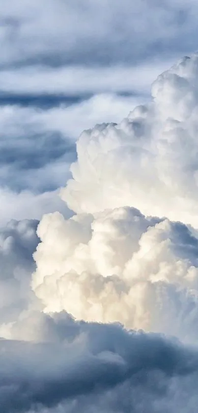 Fluffy clouds in a serene sky phone wallpaper.