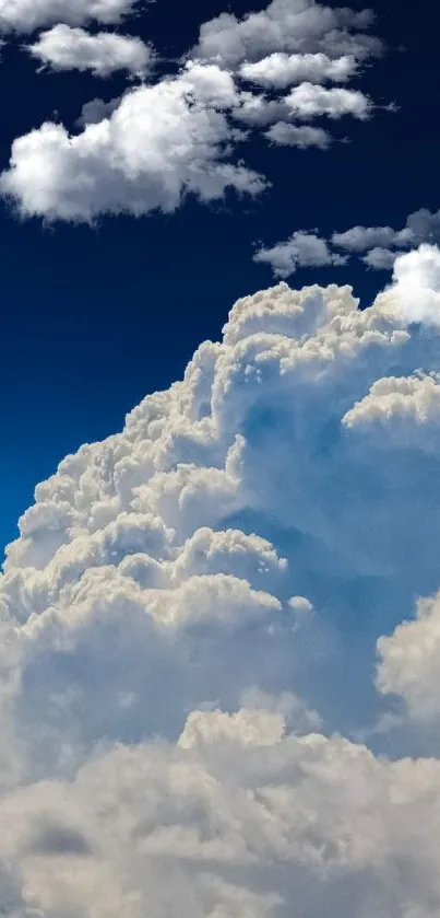 Cloudy sky with deep blue tones and white clouds in a serene scene.