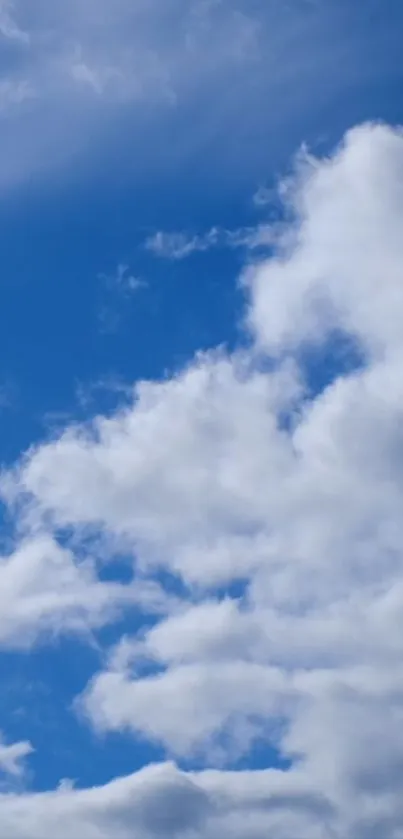 Peaceful cloudy sky with vibrant blue background.