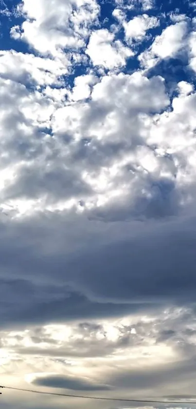 Serene cloudy sky with soft light and shades of blue.