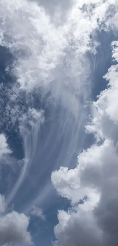 Serene cloudy sky with blue hues and wispy clouds.