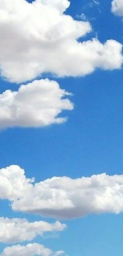 White clouds on a vibrant blue sky wallpaper.