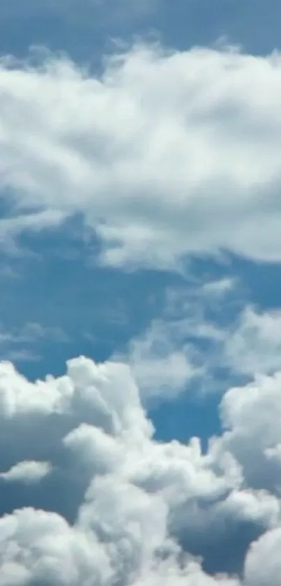 Serene photo of clouds against a sky blue background.