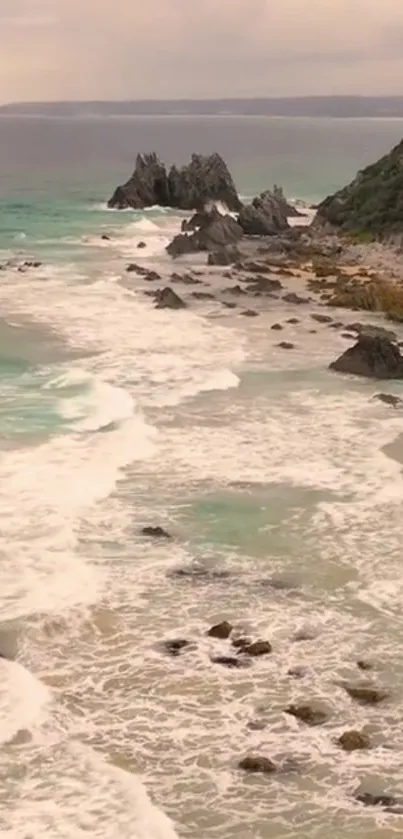 Serene coastal scene with waves and rocky shore.