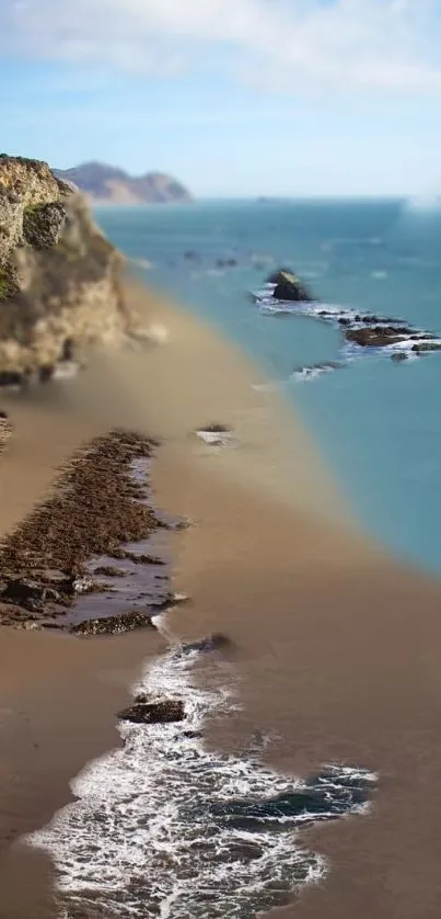 Tranquil coastal beach with azure waters and sandy shores, perfect for a calming wallpaper.