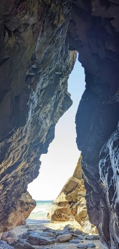 A stunning view through a coastal cave opening to the ocean beyond.