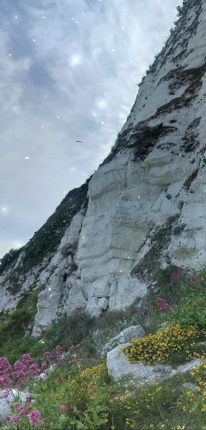 Serene coastal cliff with wildflowers under a dramatic sky.