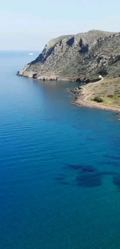 Aerial view of serene coastal cliff with blue ocean.