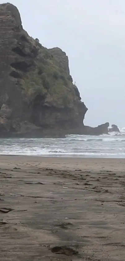 Mobile wallpaper of a coastal rock and beach scene