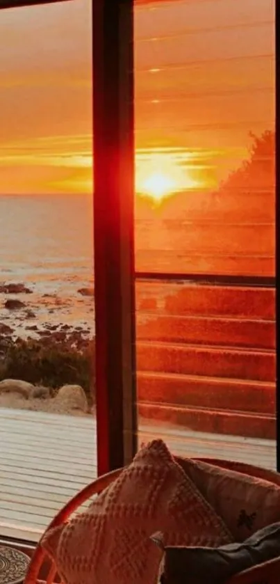 Serene sunset view from a window with ocean and warm colors.