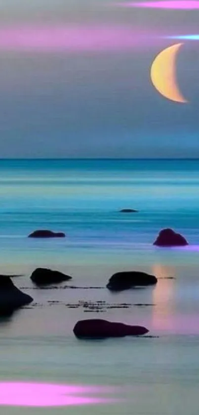 Crescent moon reflecting on a tranquil ocean with rocks.